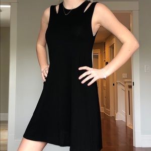 Black cotton dress. Slits in the sleeve